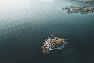 aerial photography of an island at sunset