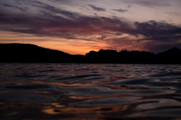 sunset over the sea and mountains