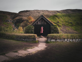 a person entering an old house