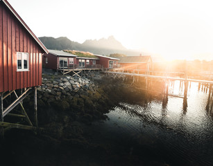 a red fisherman's cottages at sunrise