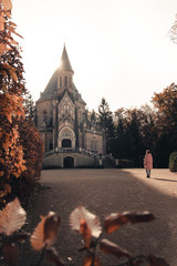 person in front of cathedral at sunrise