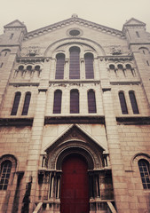 Fototapeta na wymiar Side door and facade of Sacre Coeur Cathedral on Montmartre , Paris, France.