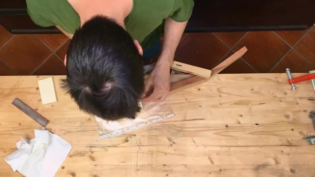 Time lapse of Luthier making guitar neck, close up