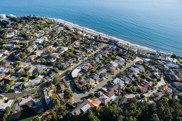 Aerial of ocean view homes between Santa Monica and Malibu in the Pacific Palisades neighborhood of Los Angeles, California.  