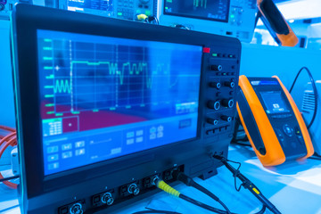 Instrumentation in the laboratory. Oscilloscope. Radioelectronics.  Research of parameters of an electric signal. Graphics on the device screen. Scientific research.