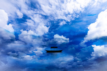 Naklejka na ściany i meble Beautiful Lake and single Boat with surround clouds.
