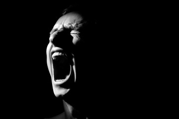 black and white photo on a black background, distorted face screaming - 280616746