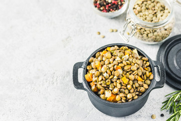 Brown lentil with vegetables. Top view, space for text.