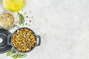 Brown lentil with vegetables. Top view, space for text.