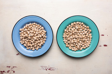 Chickpeas in the two blue plates on the table