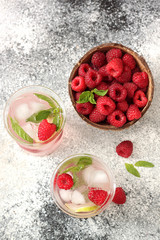 Fresh lemonade with  raspberry, mint and ice cubes 