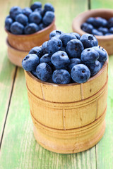 Fresh blueberry in a wooden bowl