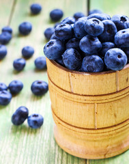 Fresh blueberry in a wooden bowl