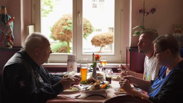 A family eating Asian Cuisine in an Asian Restaurant