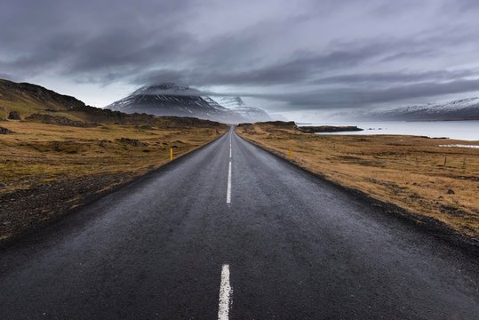 Pyramid-shaped mountain B˙landstindur, altitude 1069m, partly obscured by clouds, Ringstraﬂe, national road 1, bay Professionj&circ;rur, Suur-M˙las˝sla district, Austurland, Island