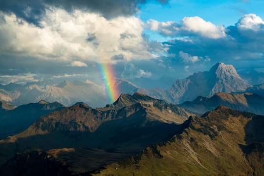 Clouds and rainbow over Allg&permil;u Alps, on the right Groﬂer Widderstein, Vorarlberg, Austria, Europe
