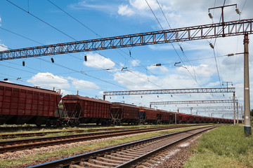 Fototapeta na wymiar Industrial railway - wagons, rails and infrastructure, electric power supply, Cargo transportation and shipping concept.