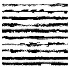 A set of grunge brushes. Black ragged stripes on white background. Abstract stains from paint roller