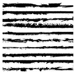 A set of grunge brushes. Black ragged stripes on white background. Abstract stains from paint roller