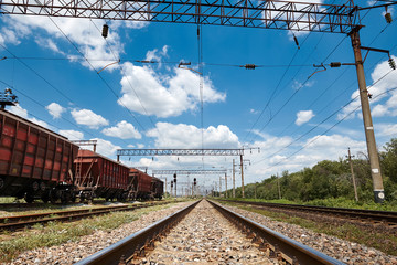 Industrial railway - wagons, rails and infrastructure, electric power supply, Cargo transportation and shipping concept.