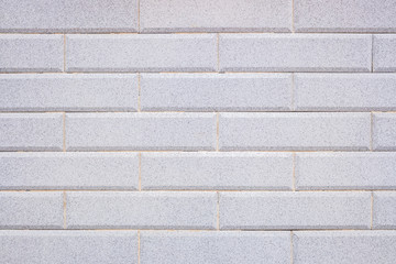 Background of symmetrical tiles of soft blue colors.