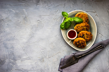 Served cutlets with fresh basil