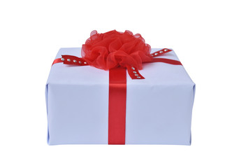 White gift box and red ribbon bow on white background. Concept for Valentine day, Christmas present and New Year.