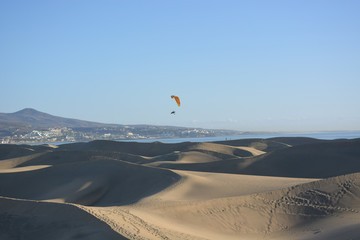 A paragliding above the desert of Mas Palomas