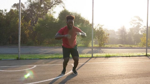 African American man working out by doing burpees