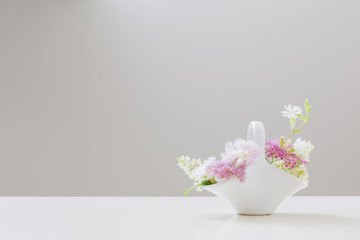 bouquet of flowers in vase on a white background