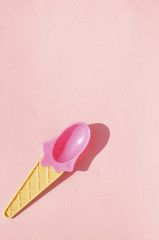 Summer pink ice cream spoon on pink background