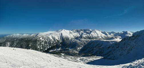 Snow covered Pirin mountains winter panorama.