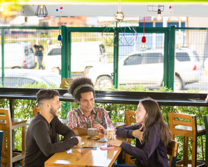 Friends have fun sharing a coffee