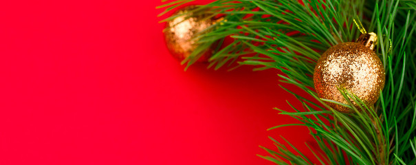 top view evergreen christmas tree brancher with golden decorative balls red background copy space