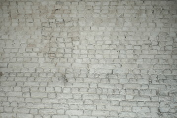 Light white or grey brick wall. Texture wallpaper background. Dirty old wall. Vintage structure.