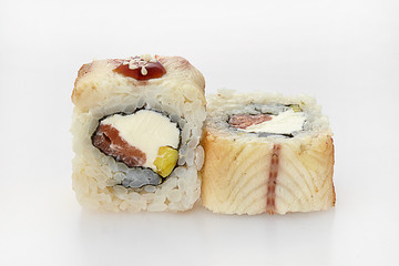 sushi rolls in salmon on a white background