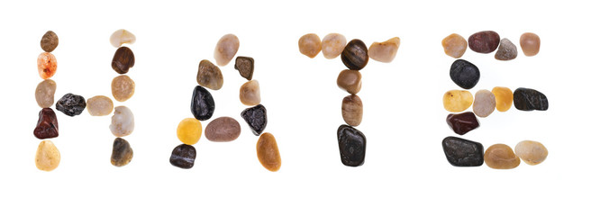 Word HATE handmade with stones (boulders). Collection words with stones. Isolated on white background