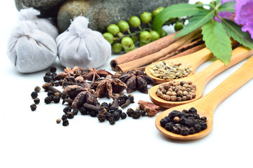 Mortar with herbs isolated on white background
