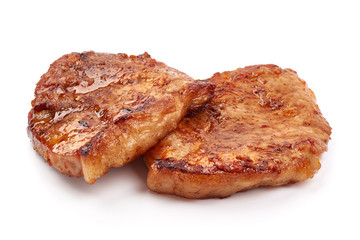 Fried juicy pork steak, isolated on white background