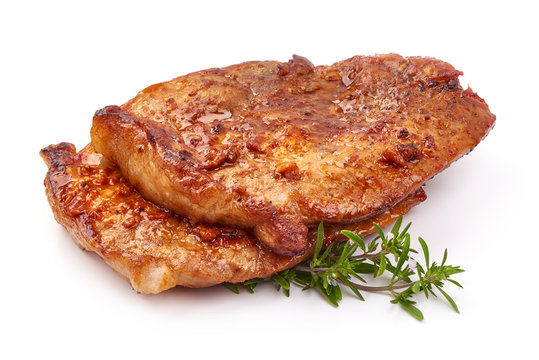 Baked juicy pork steak, isolated on white background
