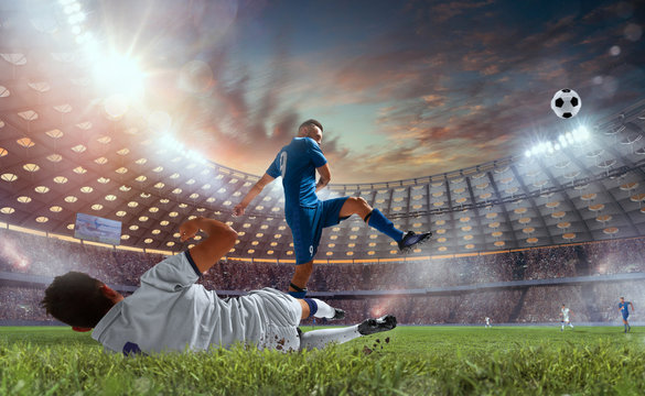 Soccer players in action on professional stadium on sunset. © VIAR PRO studio