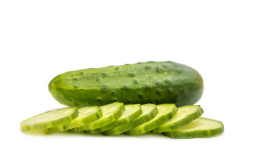Whole cucumber and sliced cucumber on white.