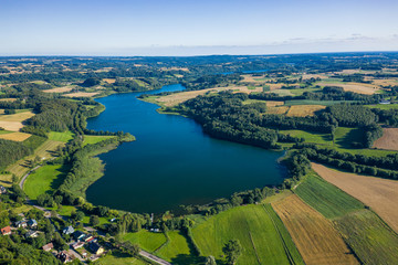 Aerial view of Kashubian Landscape Park. Kaszuby. Poland. Photo made by drone from above. Bird eye view. - obrazy, fototapety, plakaty
