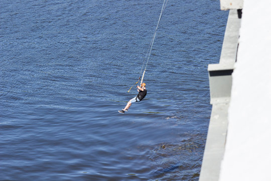 An extreme man jumps on a rope from a great height. Ropejumping..