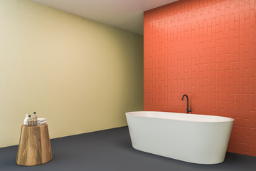 Fototapeta na wymiar Orange and lemon bathroom corner with tub