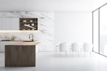 White marble kitchen, island and table