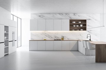 White marble kitchen, white counters and island