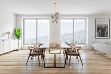 Side view of white dining room with picture