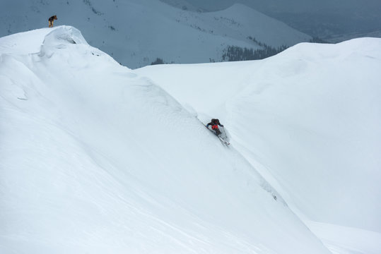 Skier descending the mountain slope