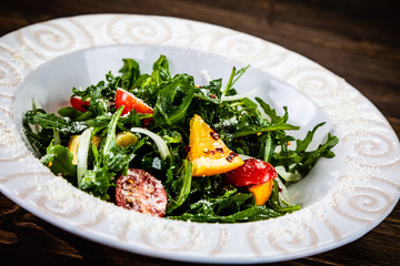 Greek salad on wooden background